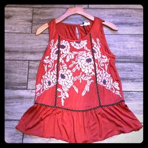 Red sleeveless top with flower embroidery
